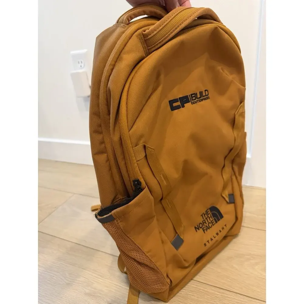 The North Face Stalwart Backpack in timber tan, customized w/a Logo.
